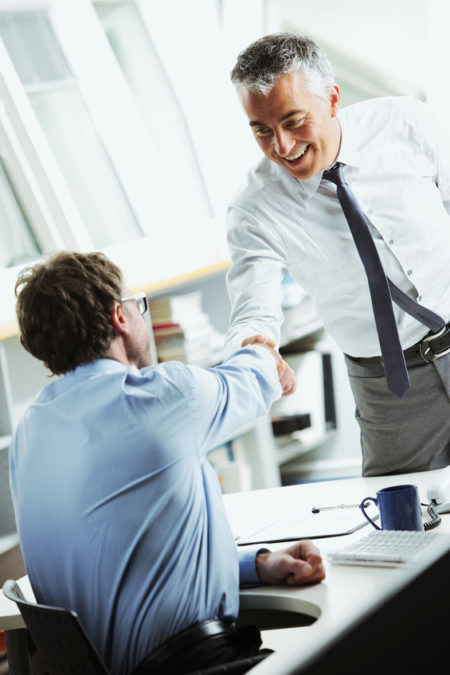 Businessmen shaking hands Businessmen shaking hands in office
